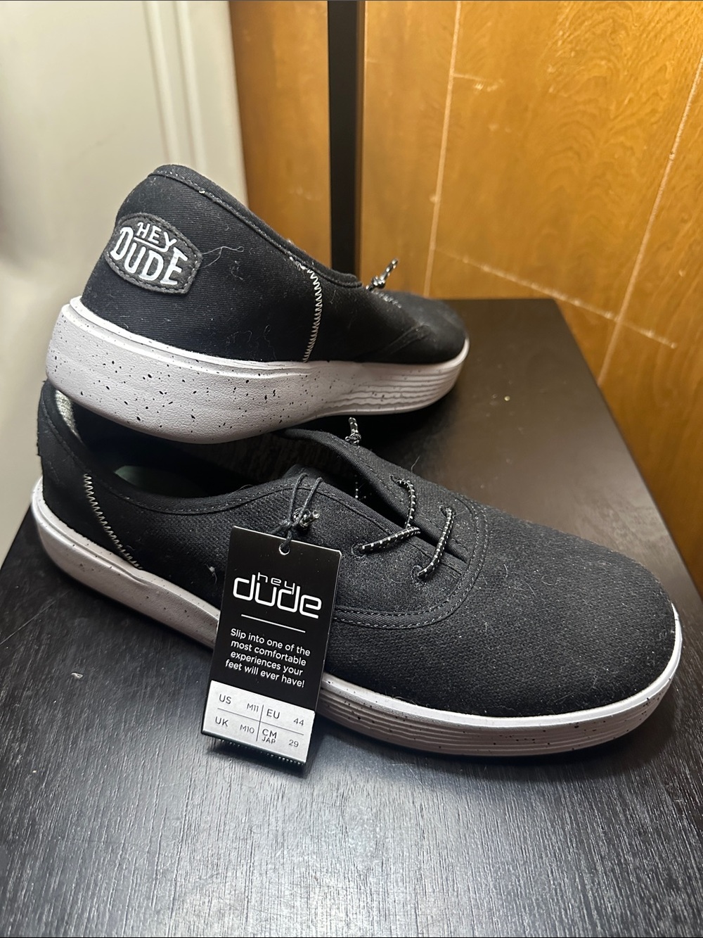 Hey Dude Conway. Black Canvas Slip-Ons with Grey Speckled Sole